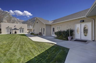Outdoor view of the facility with mountains in the background