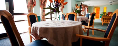 Bright common area with tables and chairs