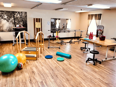 An activity room with various rehabilitation equipment