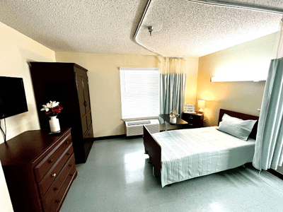 Private resident room with a bed and furniture