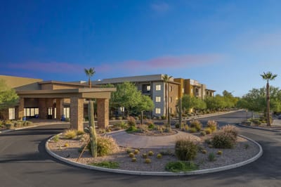 Entrance view of Inspira Arrowhead facility with landscaping