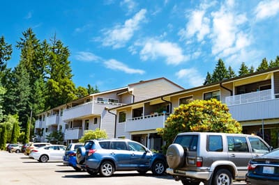 Exterior view of The Villas at Ridgemont with vehicles in parking lot
