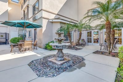 Outdoor courtyard with fountain and seating area