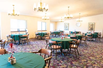 Interior dining room setup with tables and chairs