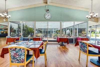 Dining room with tables and views of outdoor garden