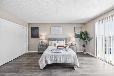 A neatly arranged private bedroom with natural light