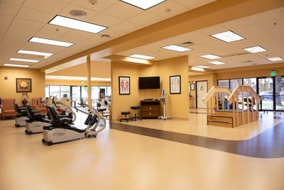 Interior view of a rehabilitation area with exercise equipment