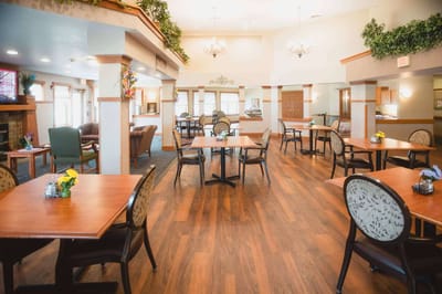 Bright and welcoming dining room with tables and chairs