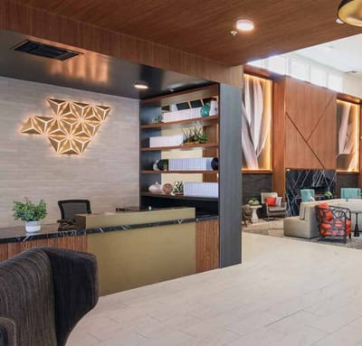 Modern interior of a lobby area featuring a reception desk