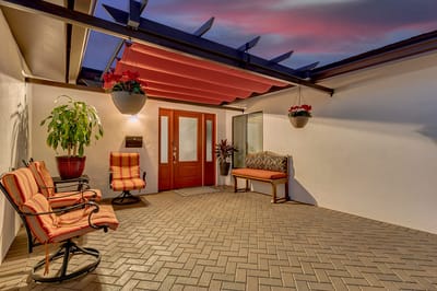 Outdoor seating area with potted plants