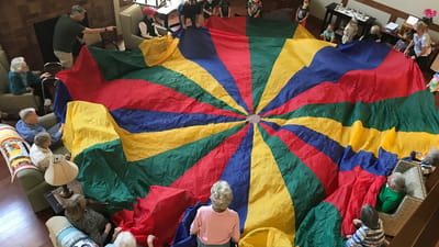 Residents engaging in a colorful group activity