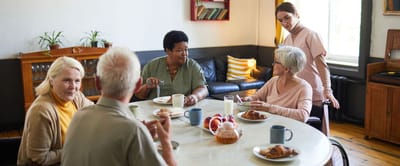Residents enjoying breakfast in a dining area