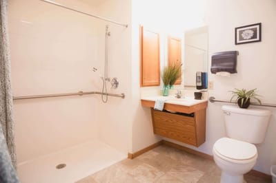 Brightly lit bathroom with safety features