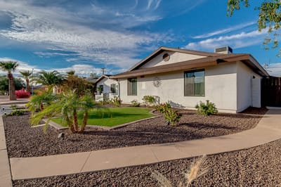Exterior view of a nursing home with landscaped garden