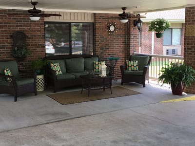 Cozy outdoor seating area with plants and decor