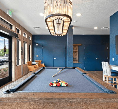 Interior view of a billiard table and lounge area