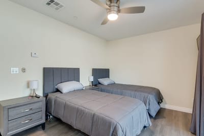 Cozy, well-furnished twin bedroom in a care facility