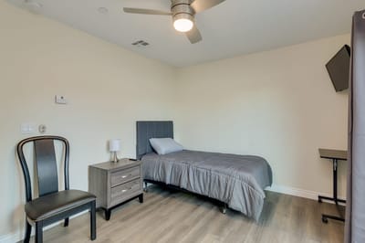 A private resident room with a bed and furniture