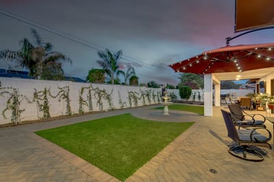 Outdoor space with a lawn and seating area