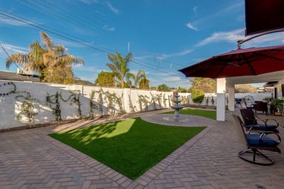 Well-maintained outdoor space with seating and landscaping