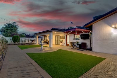 Outdoor patio area with seating and landscaping