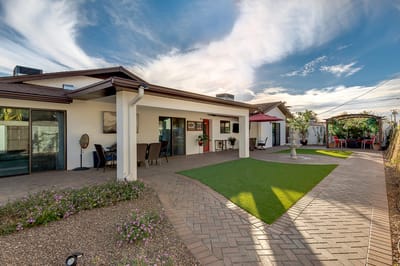 Outdoor patio area with seating and landscaping