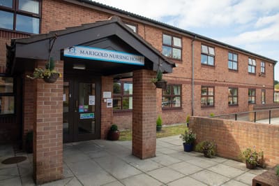 Exterior view of Marigold Nursing Home entrance
