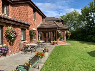 Outdoor seating area with flower planters