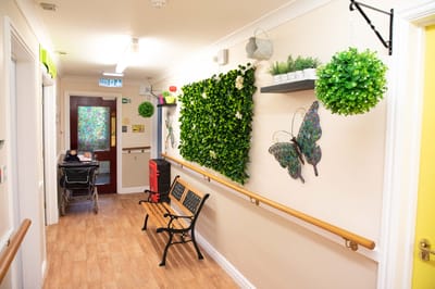 Colorful hallway with benches and greenery decorations