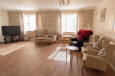 Bright common area with seating and natural light