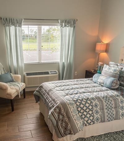 A beautifully decorated private resident room with natural light