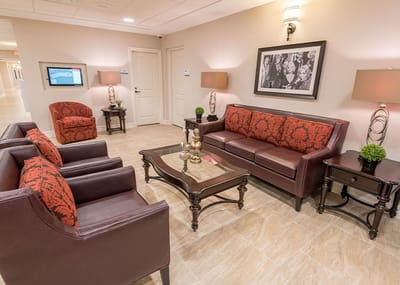 Common area with cozy seating in a nursing home