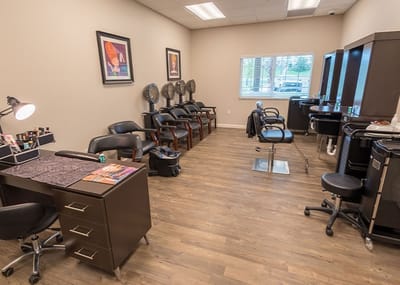 Interior of a beauty salon with salon chairs and stations
