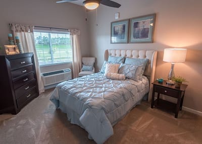 Well-decorated private resident room with cozy furnishings