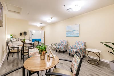 Bright common area with colorful seating and decor