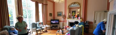 Residents and staff interacting in a cozy common area
