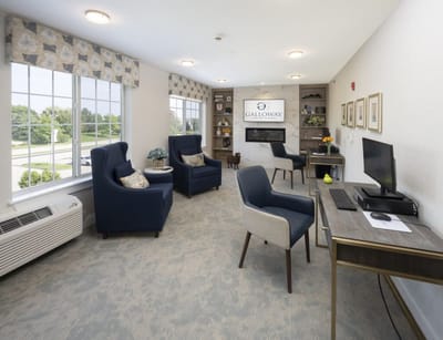 Common area with seating and a computer station