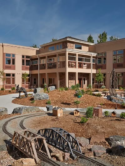 Outdoor courtyard with building and landscaped features