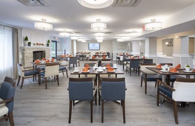 Bright dining room setup with tables and chairs