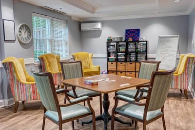 Bright common area with comfortable seating and games