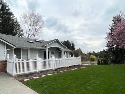 Exterior view of a senior living facility with garden