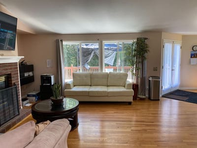 Cozy common area with a sofa and fireplace