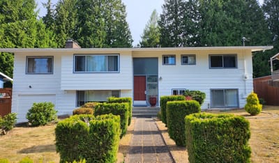 Exterior view of a residential facility surrounded by greenery