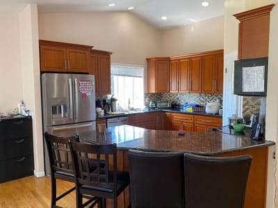 Bright kitchen area with wooden cabinets