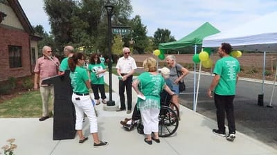 Residents and staff interacting during an outdoor event
