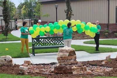 Staff preparing for a celebration in the garden area
