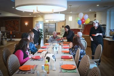 Residents enjoying a meal together in the dining area
