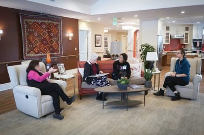 Residents engaging in conversation in a common area