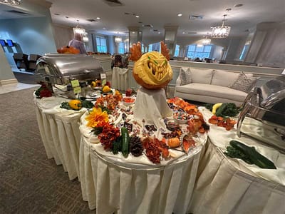 Residents enjoying a festive food display in a common area