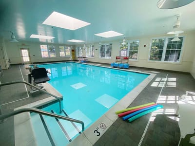 Indoor swimming pool with bright lighting